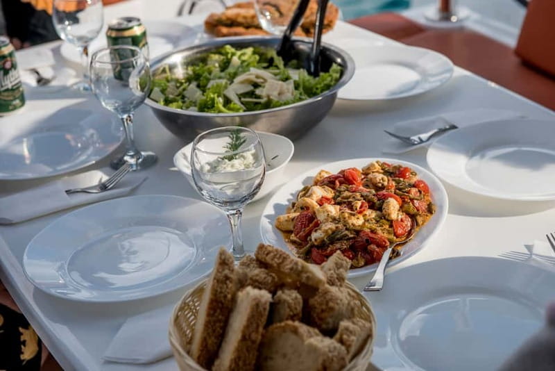 Athens: Half-Day Morning Catamaran Cruise with Meal & Drinks - What the crew adds to the experience