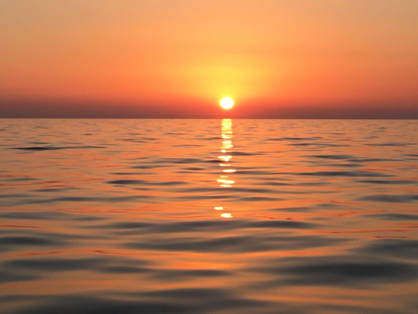 Catamaran Afternoon Cruise: Kleftiko half day with sunset - Sunset through Milos’ fishing villages