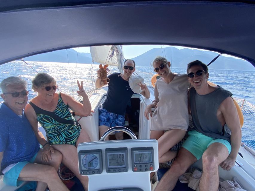 From Agia Efimia: All Inclusive Sailing Day Trip to Ithaca - The crew makes the small boat work