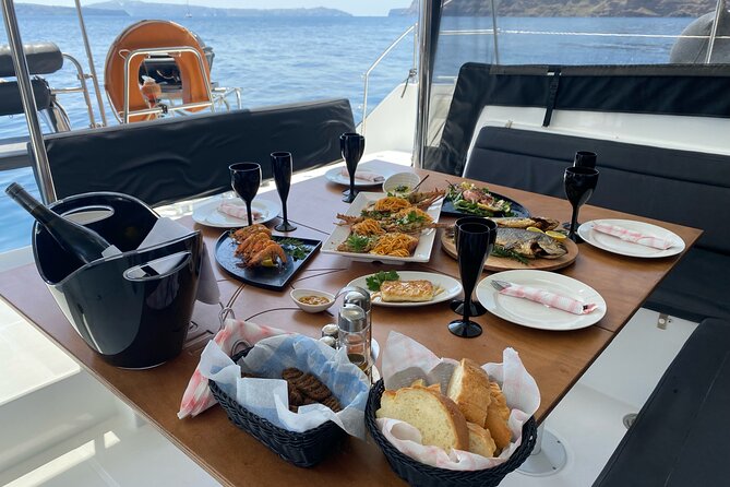 Half-Day Tailor-made Private Catamaran Cruise in Santorini - Swimming, food, and the crew
