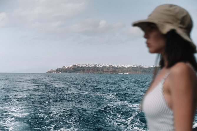 Half-Day Tailor-made Private Catamaran Cruise in Santorini - Lighthouse views and volcanic scenery