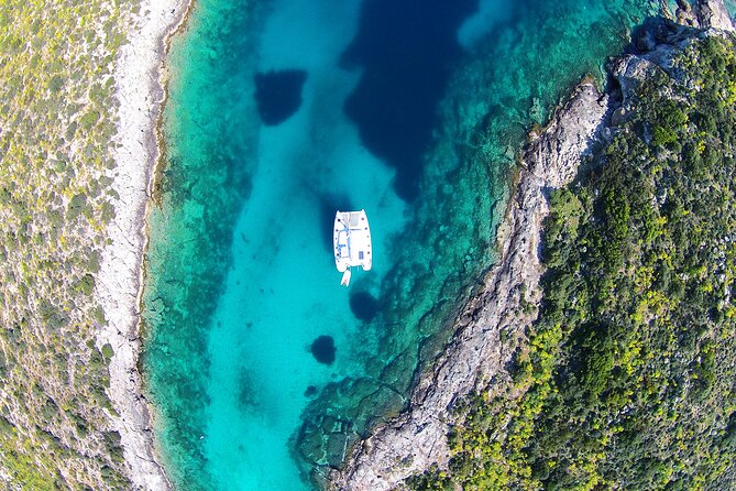 Luxury Catamaran Cruise Including pickup and Traditional Food - A private catamaran day from Athens