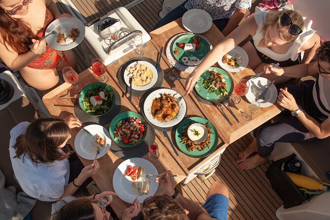 Luxury Catamaran Sunset Private & Greek Gastronomy in Athens - Sunset sailing back toward Athens