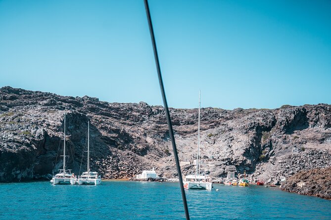 Majestic Catamaran Caldera Cruise with Snacks, Meal & Drinks - Swimming above Santorini’s hot springs