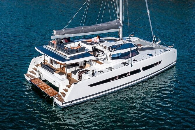 Mykonos: Brand-New Catamaran Cruise with Meal, Drinks & Transport - Rhenia offers the main swimming stop