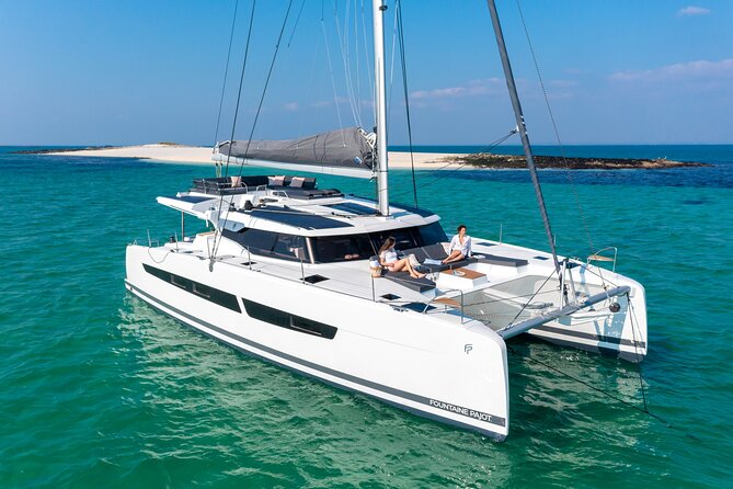 Mykonos: Brand-New Catamaran Cruise with Meal, Drinks & Transport - Boarding at Agia Anna and settling onto Aerial or White Coral