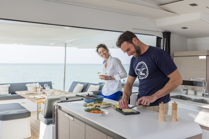 Mykonos: Luxury Catamaran Cruise with Meal, Drinks & Transport - Lunch, drinks, and what luxury means here