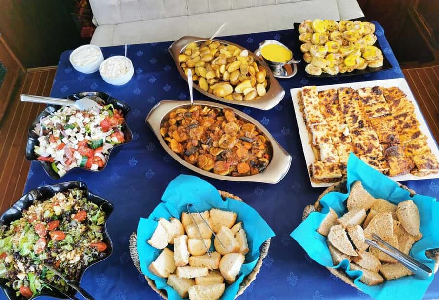 Mykonos: Sunset Sail Cruise to Rhenia, Beach Hopping, Dinner - Group size, comfort, and the sailing style