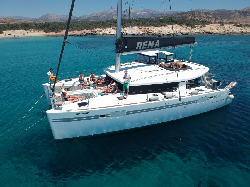 Naxos: Catamaran Cruise with Swim Stops, Food, and Drinks - Lunch, drinks, and the Greek table onboard