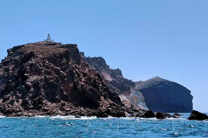 Private Full-Day Motor Yacht Cruise with Meal, Open Bar+Transfers - Sailing Beneath Oia at Sunset