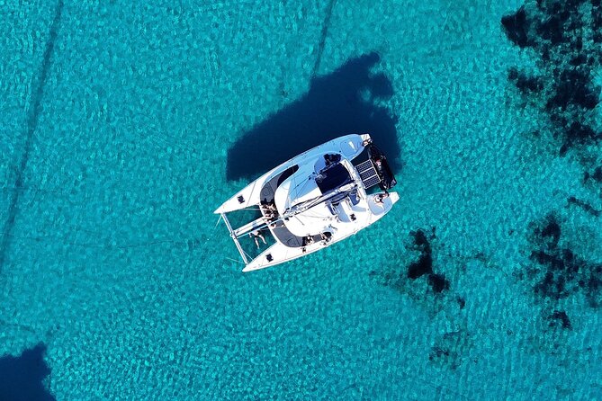 Private Mykonos Catamaran Day Cruise with Meals & Water Toys - Five hours around Ornos, Delos, and Rineia