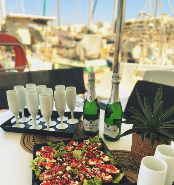 Rethymno: Sunset Catamaran Cruise - Sushi & Open Bar - Boarding at Rethymno Marina with Prosecco in hand