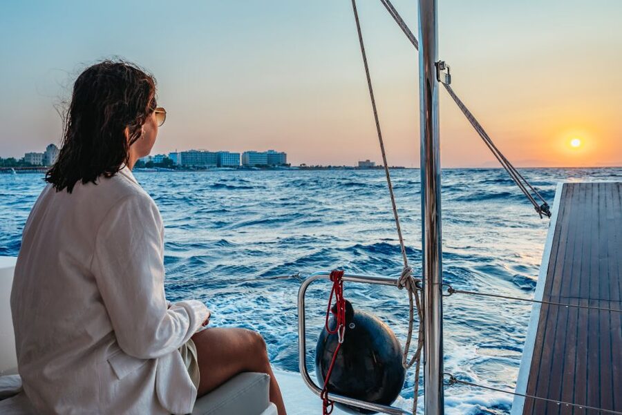 Rhodes: Sunset Catamaran Cruise with Dinner Buffet & Drinks - Watching the Aegean sunset near Rhodes Town