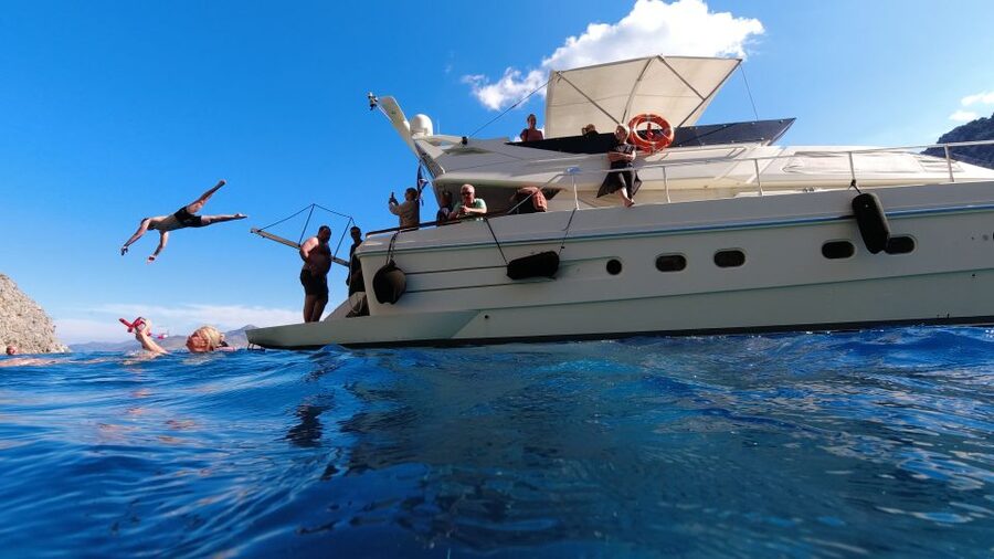 Rhodes: Symi Yacht Tour with Unlimited Drinks and Transfer - St. George Bay, the best stop for swimming