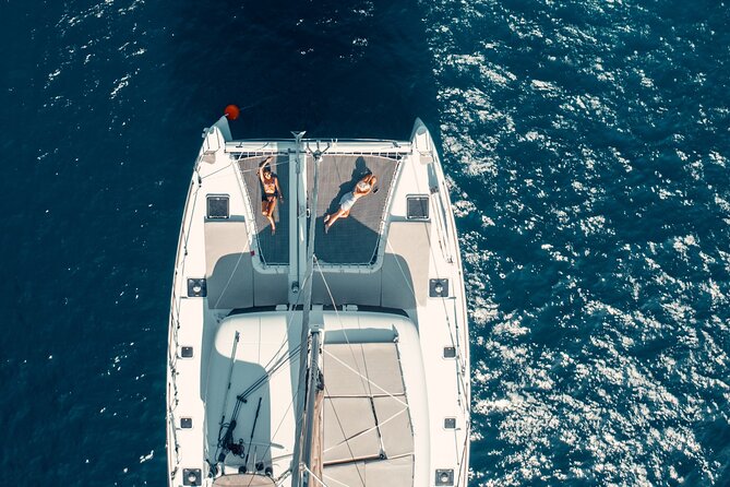 Romantic Sunset Catamaran Caldera Cruise incl. Meal & Drinks - Food, drinks, music, and the feel on board