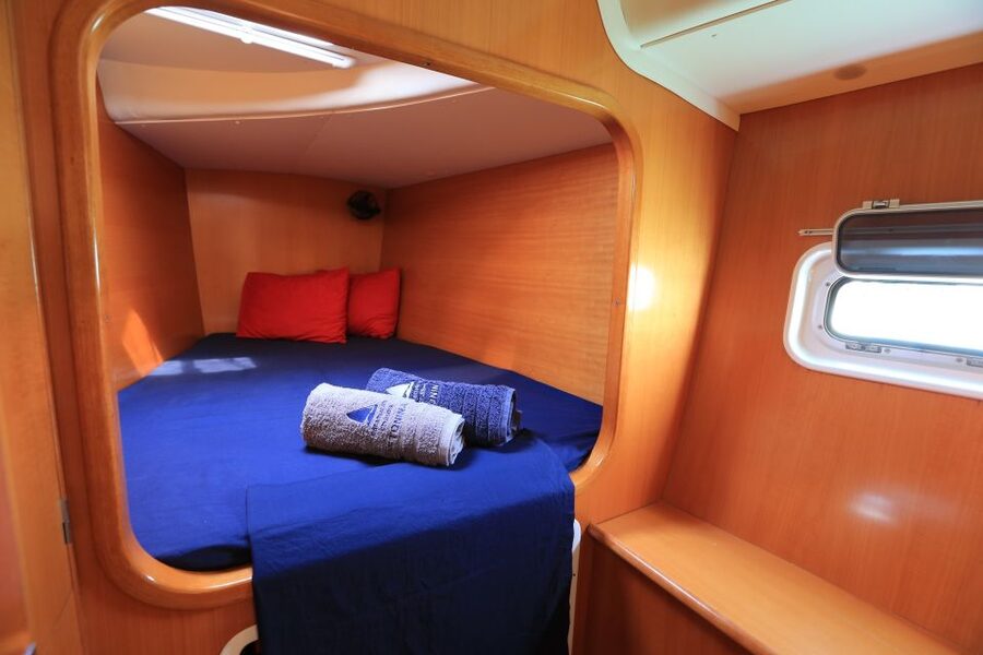 Santorini: 7-Hour Private Catamaran Cruise with Food & Drink - Food, drinks, and the three-person crew