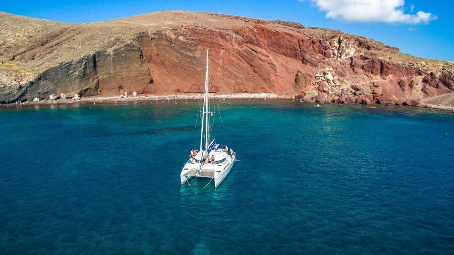 Santorini: 7-Hour Private Catamaran Cruise with Food & Drink - Mesa Pigadia and the sunset finale