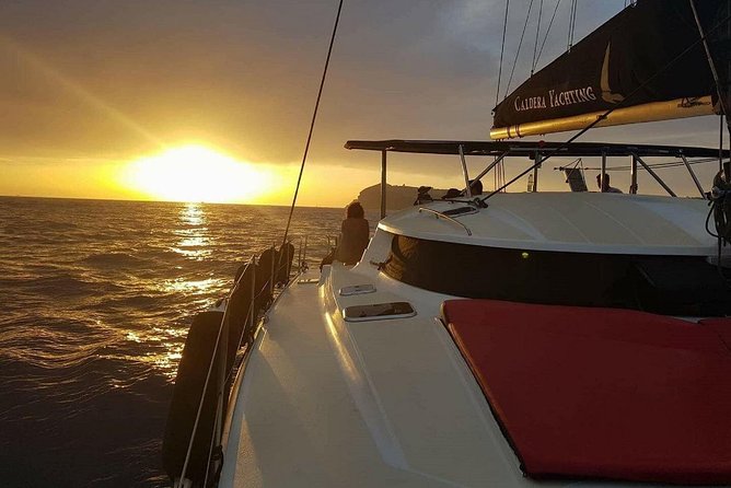 Santorini Adventurous Catamaran Experience with Snorkeling - Lighthouse views and the southern coast