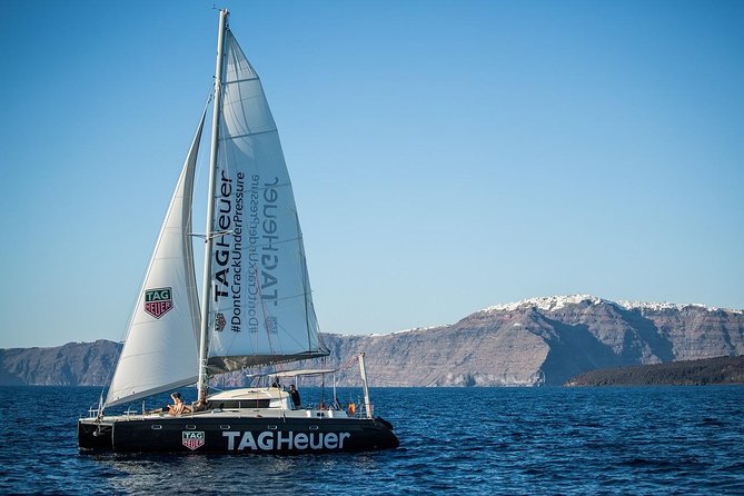 Santorini Adventurous Catamaran Experience with Snorkeling - Lunch, dinner, wine, and the social side