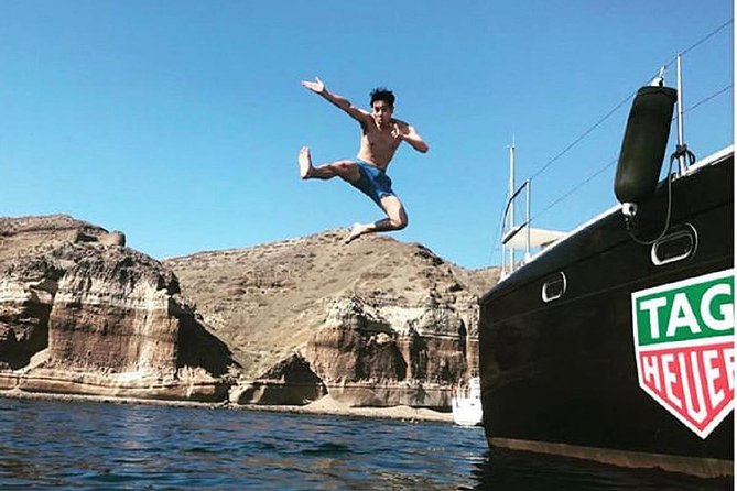 Santorini: Adventurous Catamaran Experience with Snorkeling - From Fira to Vlychada Harbor