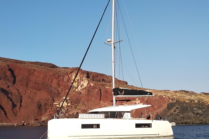 Santorini All-inclusive Private Catamaran Cruise - Pickup from your hotel to Vlychada Port