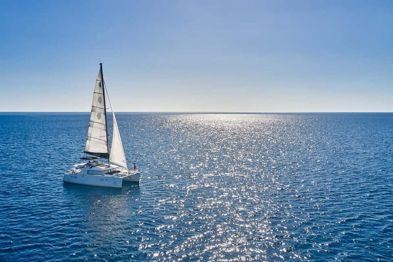 Santorini: Caldera Classic Catamaran Cruise w/ Meal & Drinks - Akrotiri Lighthouse and the Indian Face Mountain