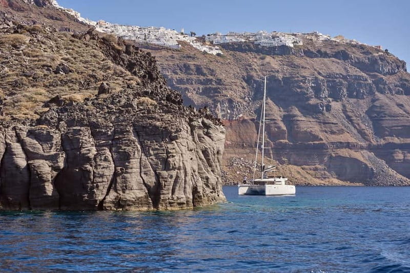 Santorini: Caldera Classic Catamaran Cruise w/ Meal & Drinks - Nea Kameni’s Black Lava Shore