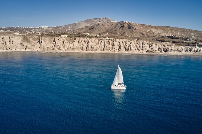 Santorini: Caldera Private Catamaran Cruise with Meal & Drinks - Twenty minutes at black-sand Mesa Pigadia