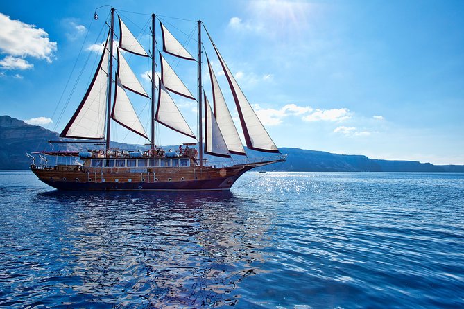 Santorini Caldera Sunset Sailing Cruise with Dinner and Wine - Palea Kameni: warm water, sulfur, and a 30-meter swim