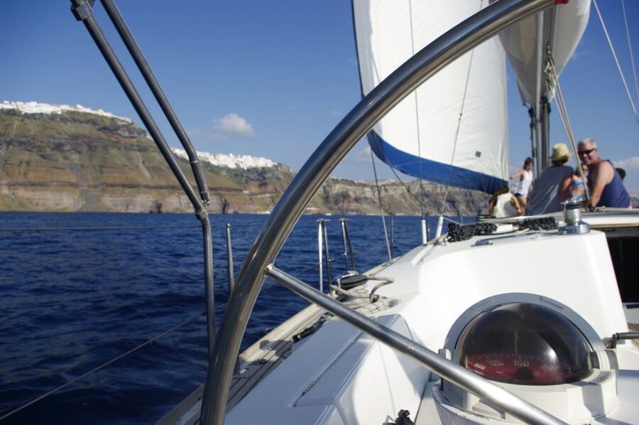 Santorini Caldera: Sunset Sailing Cruise with Meal - Red Beach and White Beach from the water