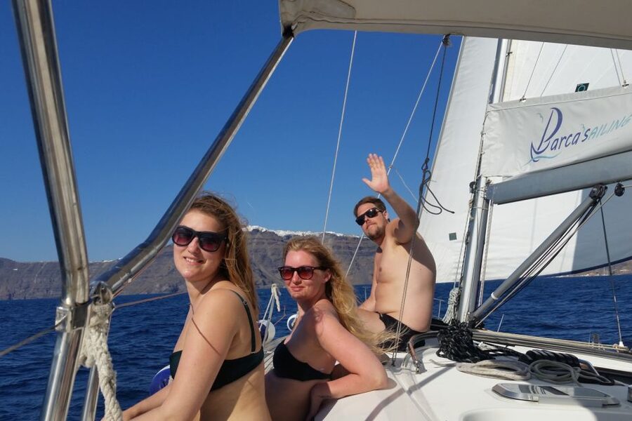 Santorini Caldera: Sunset Sailing Cruise with Meal - Indian Rock, the lighthouse, and the turn into the caldera