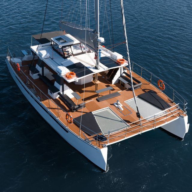 Santorini: Catamaran Caldera Cruise with Meal and Drinks - Three stops for swimming, snorkeling, or doing nothing