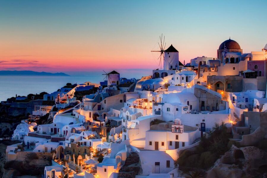 Santorini: Catamaran Cruise, Winery, & Oia Sunset Combo Tour - Oia at sunset and the old castle ruins