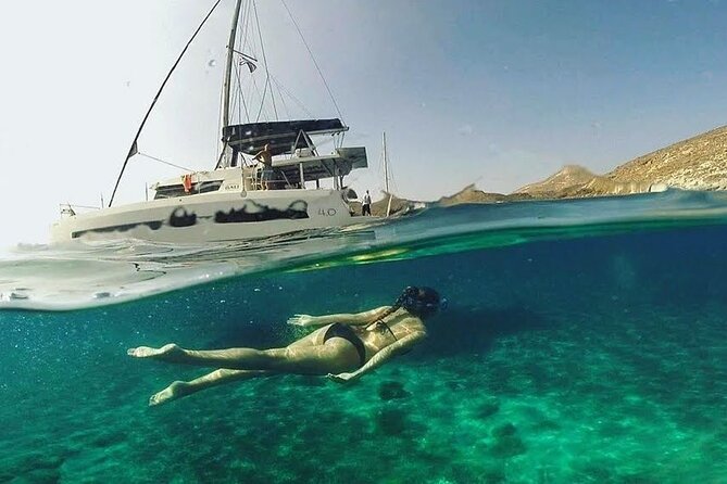 Santorini Catamaran Cruise with Fresh Meal and Open Bar - White Beach and the Akrotiri lighthouse