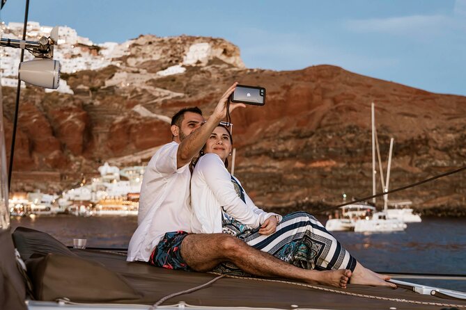 Santorini Catamaran Cruise with Greek Meal, Open-Bar and Sunset - Luxury versus classic departures