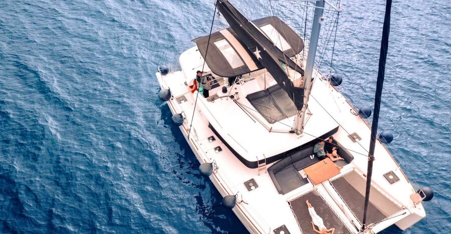 Santorini: Catamaran Cruise with Lunch, Drinks, & Oia Visit - Oia and Ammoudi Bay from the water