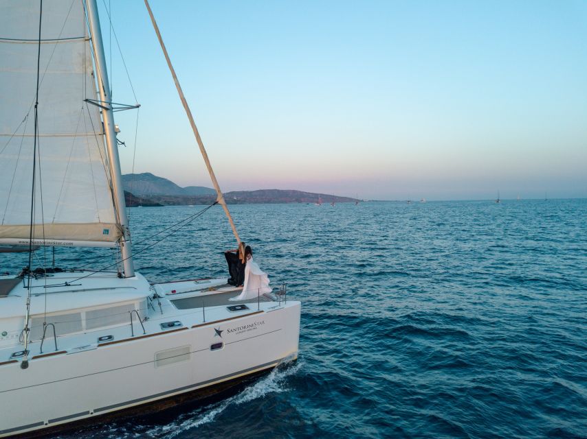 Santorini Catamaran Cruise with Swimming, Meal and Open Bar - From Thera or Oia to Vlychada Marina