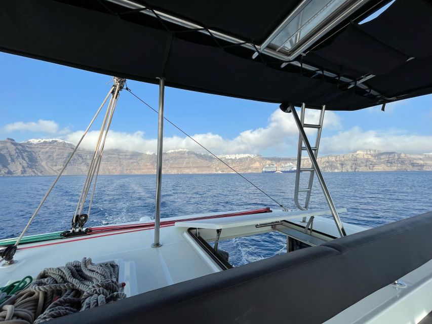 Santorini Catamaran Cruise with Swimming, Meal and Open Bar - Indian Rock and Black Mountain on the way home