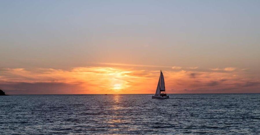 Santorini Catamaran Sunset Skyline Cruise - White Beach, Mesa Pigadia, and the open water