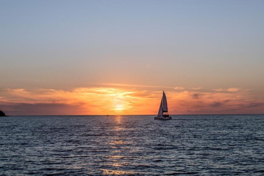 Santorini Catamaran Sunset Skyline Cruise - Akrotiri Lighthouse and the caldera entrance