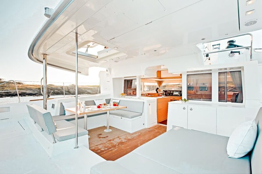 Santorini: Catamaran Tour with BBQ Meal and Unlimited Drinks - What the crew and onboard service add