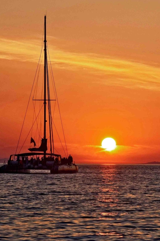 Santorini: Cruise Catamaran with BBQ & Drinks Day or Sunset - White Beach, snorkeling, and the onboard barbecue