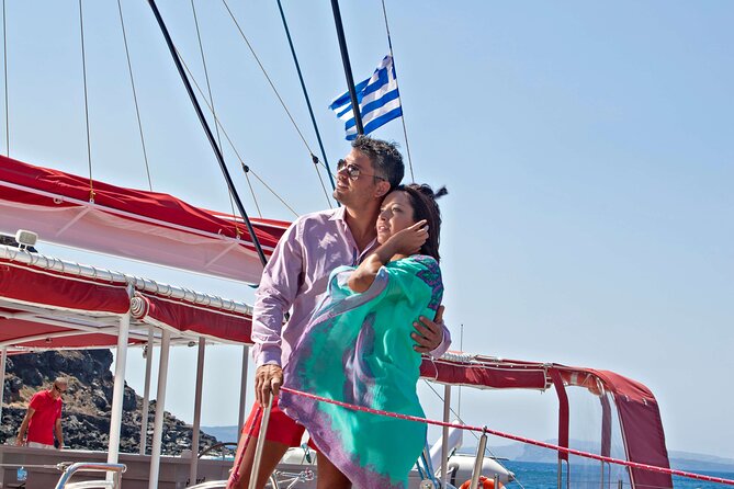 Santorini Cruise on Catamaran with BBQ & Open Bar - Red Beach for photos and snorkeling