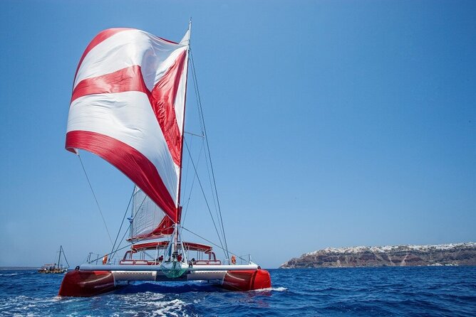 Santorini Cruise on Catamaran with BBQ & Open Bar - White Beach, lunch, and the longest stop