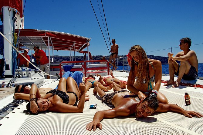 Santorini Cruise on Catamaran with BBQ & Open Bar - Pickup at your hotel and the trip to port