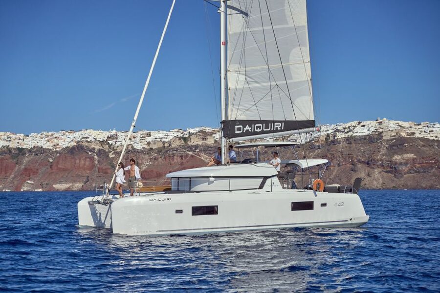 Santorini: Day Luxury Catamaran Cruise with Meal & Drinks - Thirassia Island brings the first swim