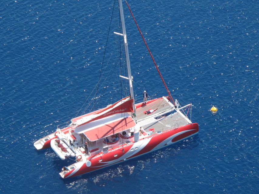 Santorini: Dream Catcher 5-hour Sailing Trip in the Caldera - Sailing past Akrotiri and the southern beaches