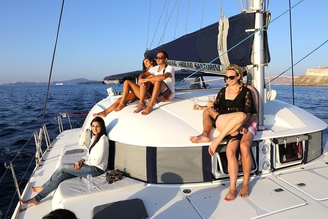 Santorini Half Day Catamaran Private Cruise incl. Meal, Drinks & Free Transport - Red Beach and White Beach by Boat