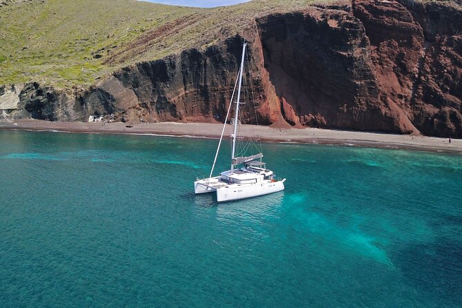 Santorini: Luxury Catamaran Cruise with Fresh Fish BBQ & Drinks - White Beach: a view you cannot reach by road