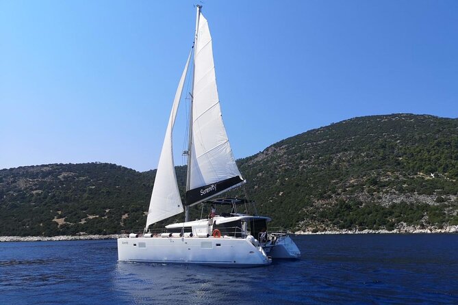 Santorini: Luxury Catamaran Cruise with Fresh Fish BBQ & Drinks - Mesa Pigadia: the best stop for swimming